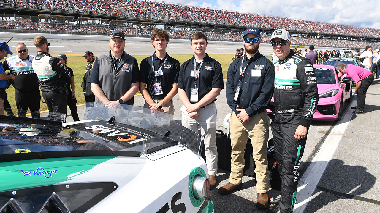 The ICAMS team, Joshua Whiting, Jack Walden, Johnathan Deery and John Price, with RFK Racing driver Brad Keselowski.