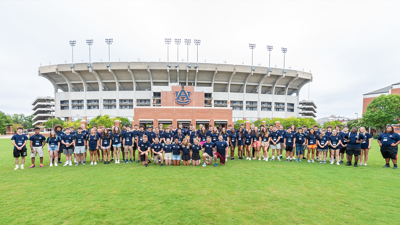 Participants in the Seniors Tigers Engineering Camp pose in front of Jordan-Hare Stadium.