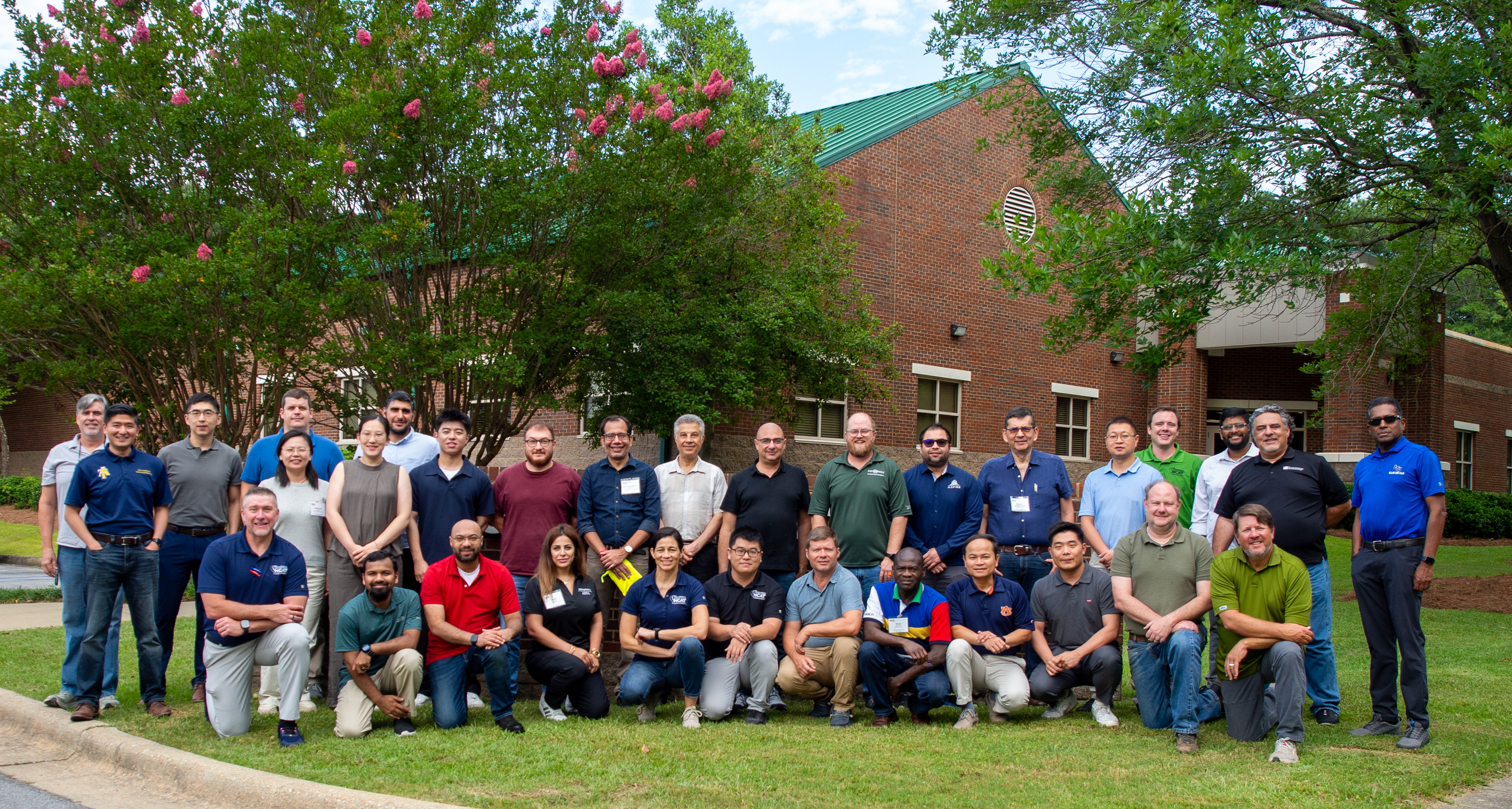 Professor training course group photo outside NCAT main facility
